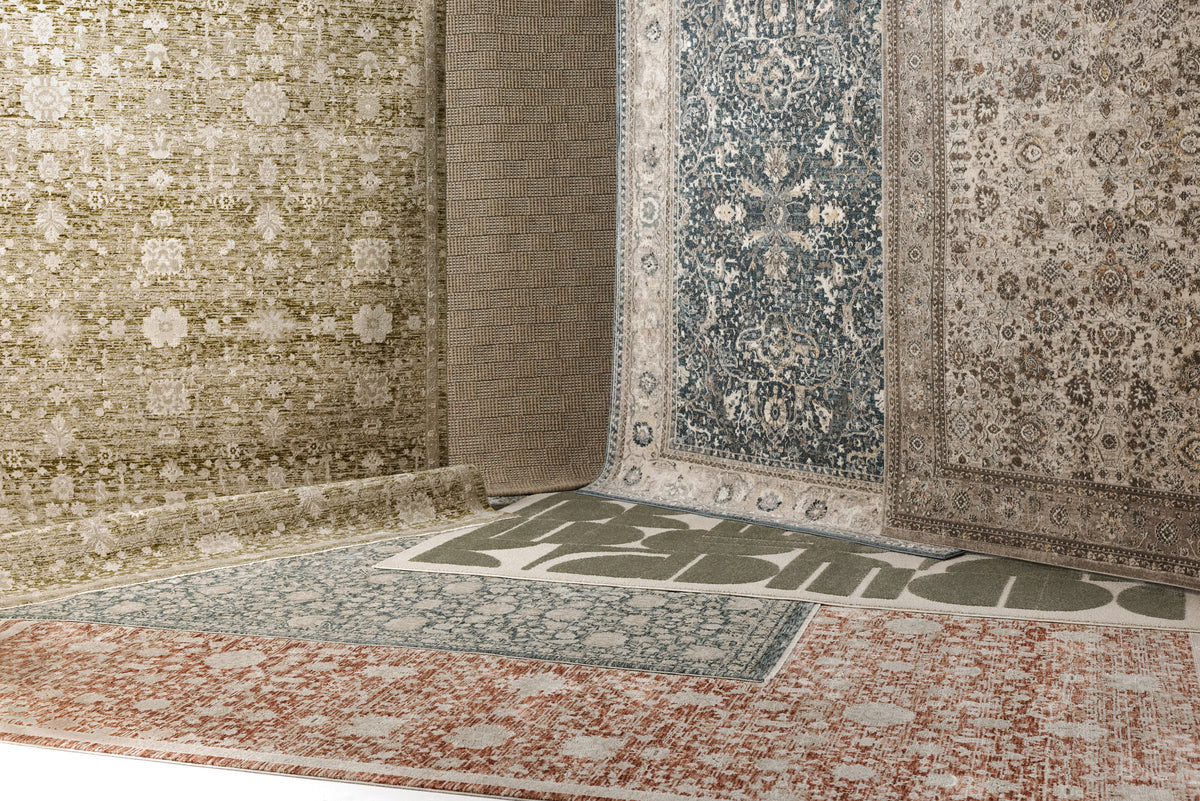 A collage of six traditional-style area rugs with vintage floral and geometric patterns in muted tones of blue, rust red, sage green, olive, and beige.